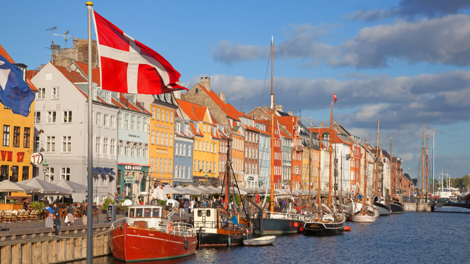 A row of boats in a harbor in Copenhagen, Denmark